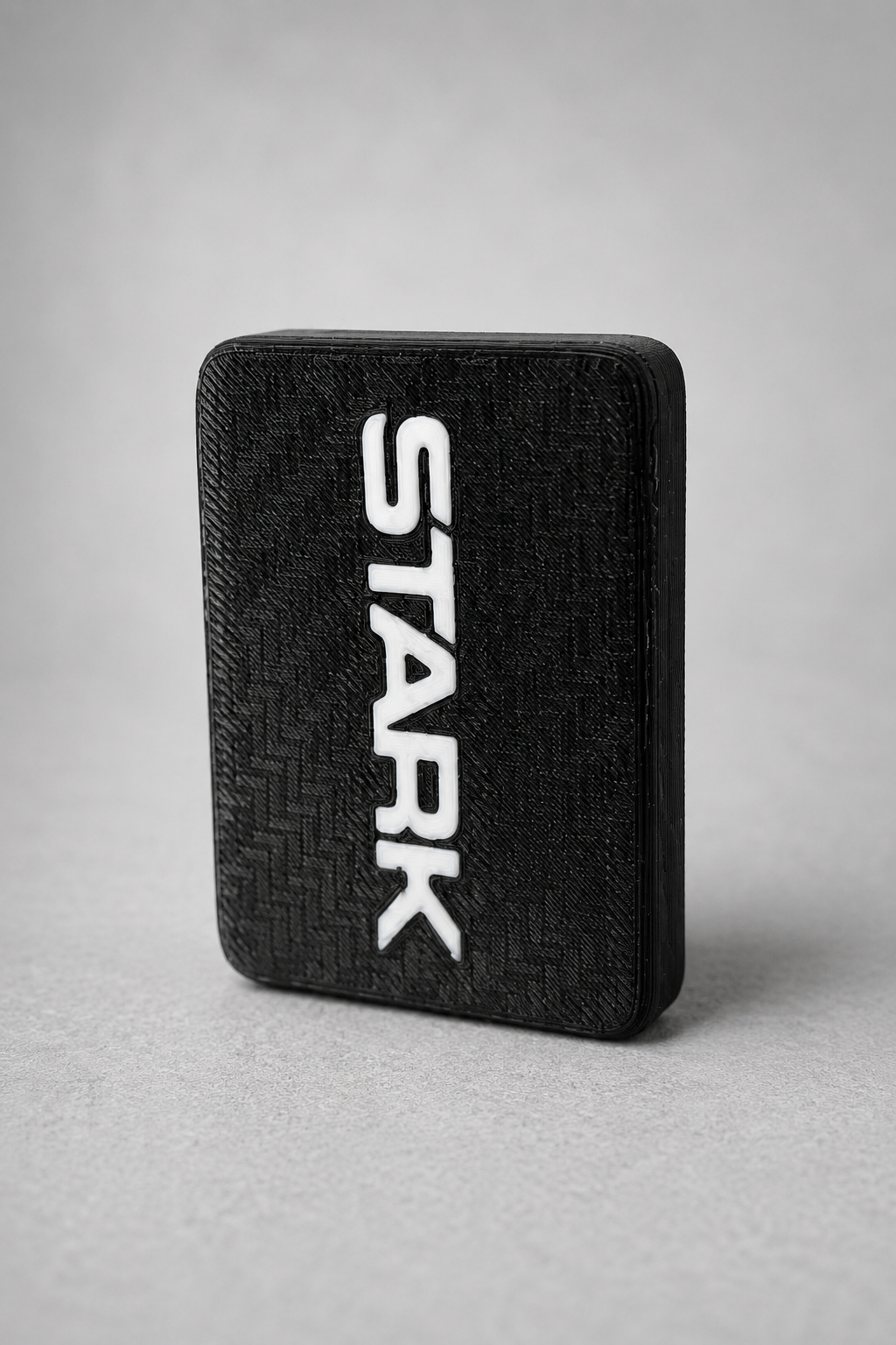 Finished black TPU RFID holder with contrasting white branding